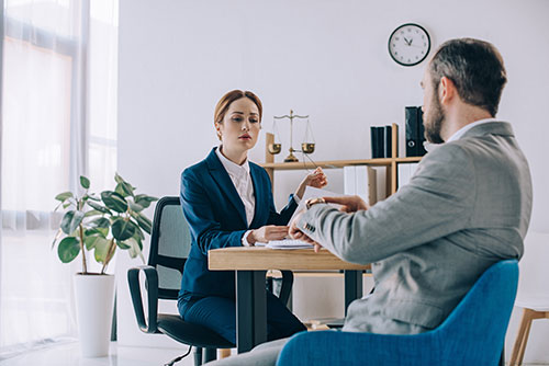 woman sitting with client going over finances
