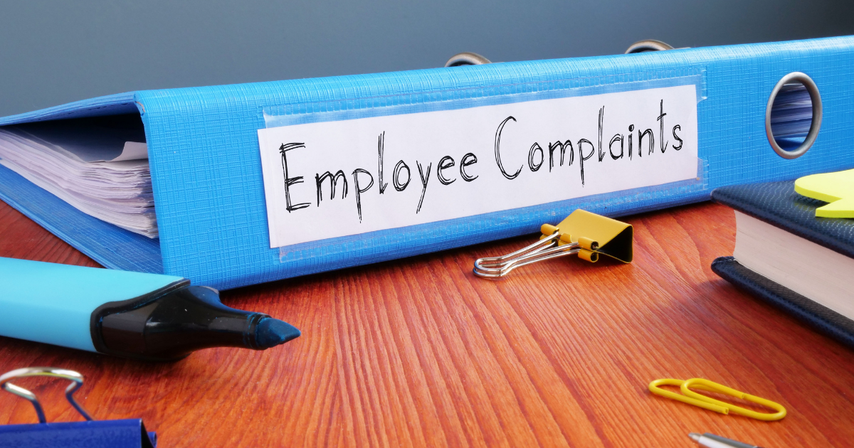 What to Do When an Employee Files a Complaint - employee complaints binder on a desk